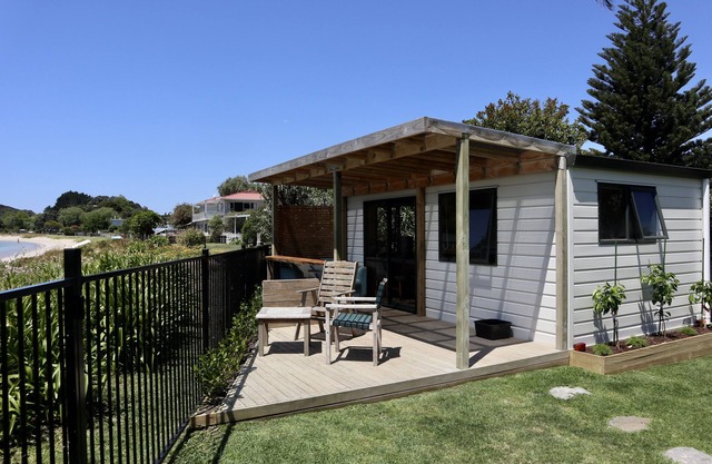 Beachside Cabin with view of Mount Pataua and Surf bar