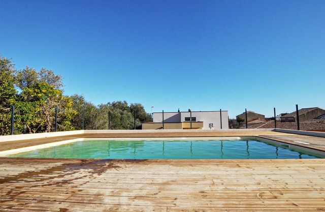 Beautiful and modern vacation home with communal pool and sea view from the terrace.