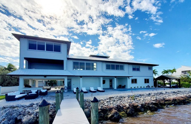 Beautiful brand new oceanfront 4/4 home with private pool and dockage.