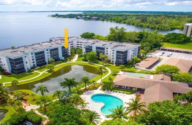 Beautiful condo located directly on the River with pool side & lake views