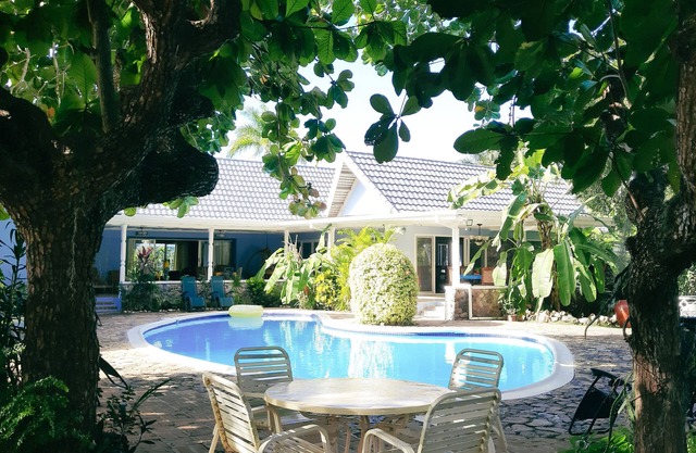 Beautiful garden villa. Family friendly. Just a short walk to a private beach.