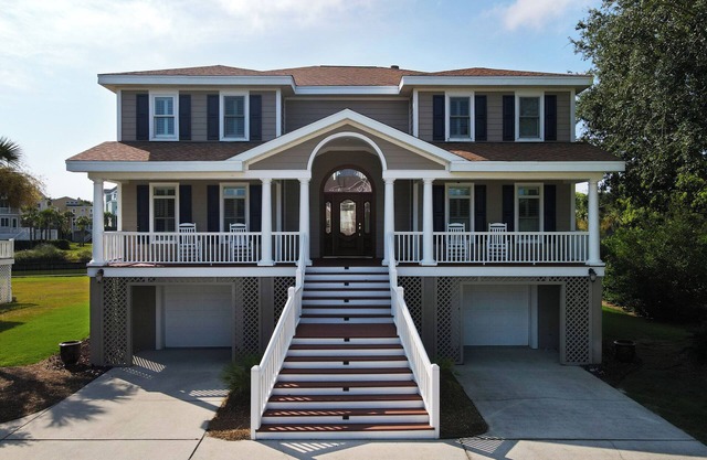 Beautiful home with open porches overlooking lagoon in Wild Dunes