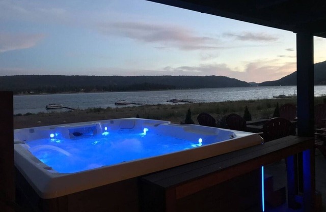 Beautiful lakefront home with guest house, dock, game room, hot tub