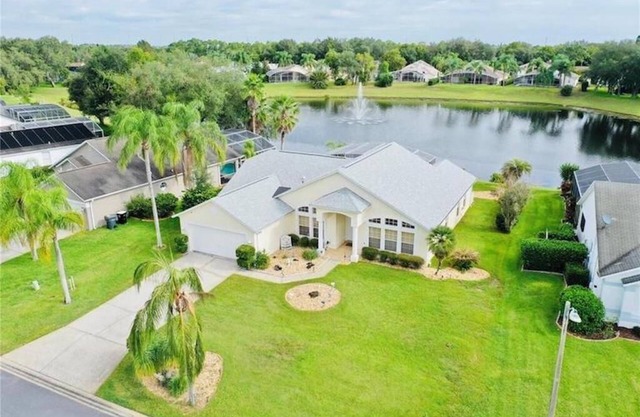 Beautiful waterfront home with heated pool and game room.