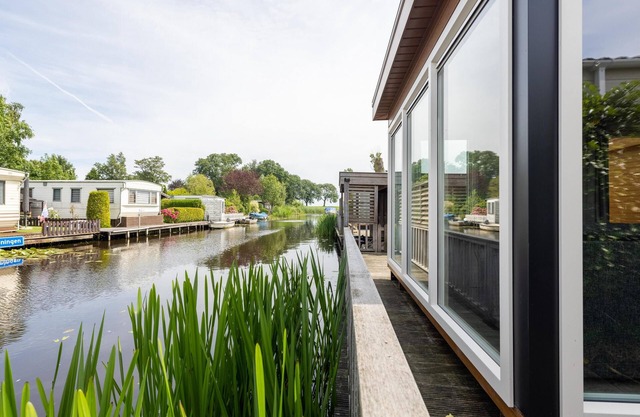 Big Chalet in Friesland by the water with sloop