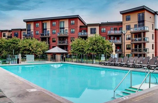 Bright Corner Unit with Lake and Pool Views #543