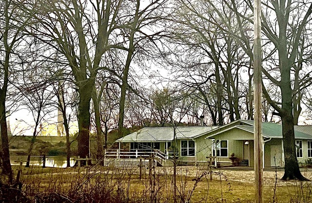 Cabin sits in the back of a wild pecan grove over looking the Arkansas River