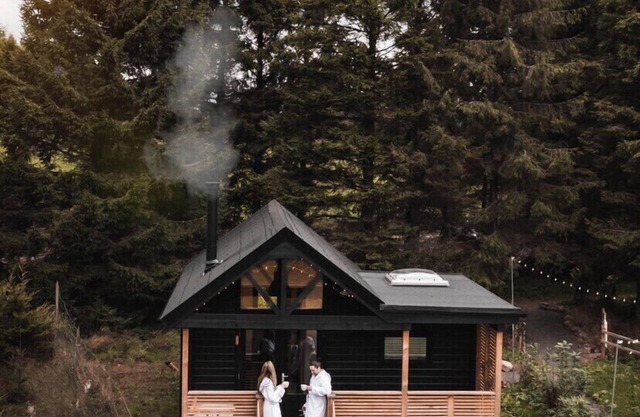 Cabin, with deck and outside bath in woodlands