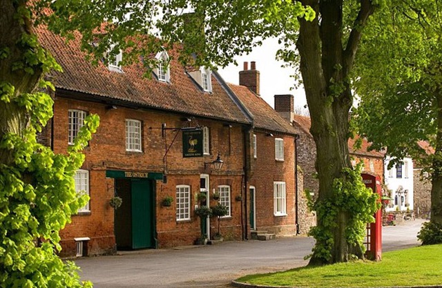 CASTLE ACRE. Cottage set in a Norman village overlooking the Village Green