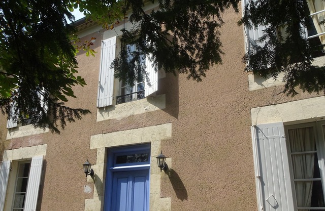 Character house overlooking wooded park in the heart of a village