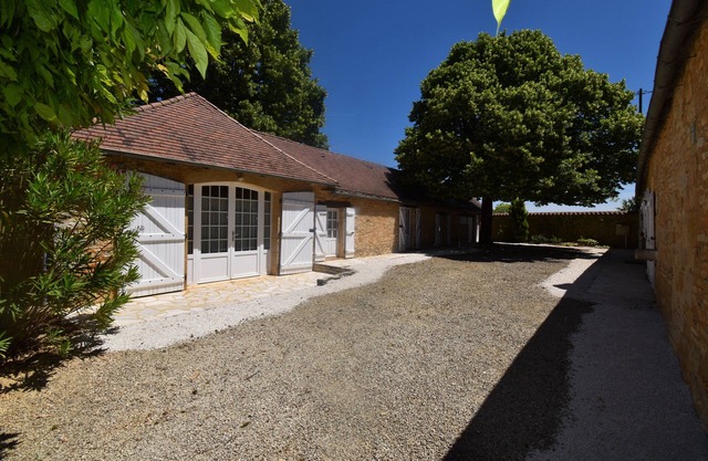 Charming stone house with shared, heated swimming pool and landscaped park