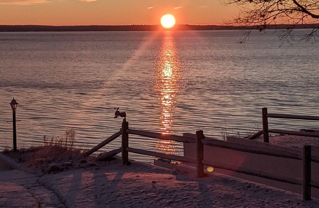 Charming 2-bedroom cabin sits on 2.5 acres on Hubbard Lake.