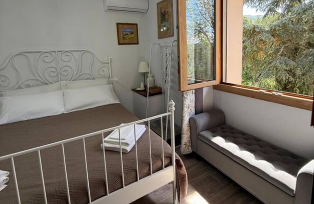 Charming Guest Room in Villa Casavecchia with City, Garden, and Mountain Views