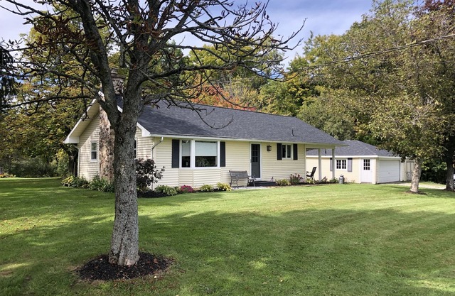 Charming, recently updated country ranch home on quiet, scenic, acre lot.