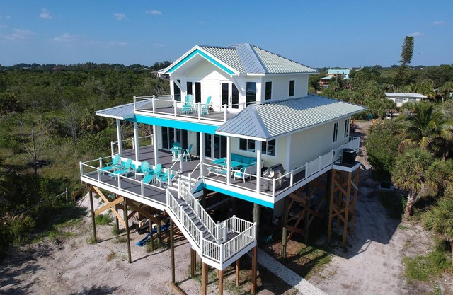 Cloud 9 on the beach! Heavenly views from beach to bay. Come be on Cloud 9.