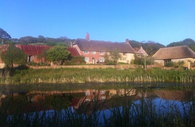 Coastal 6 bedroomed property set in own farmland yet not far from ammenties.