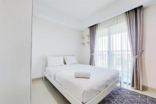 Comfort 1BR without Living Room Bintaro Embarcadero Apartment By Travelio