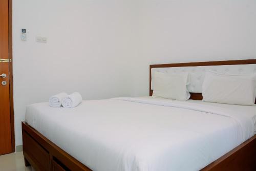 Comfortable 2BR Green Central City Glodok Apartment By Travelio