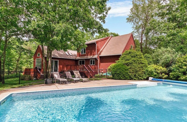 Contemporary Hampton Bays home on one acre of manicured lawn, private pool,.