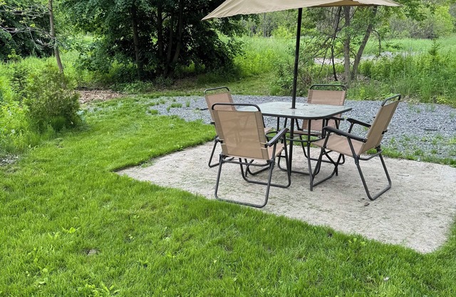Convenient Campsite W/fifth wheel camper, Creek Front.