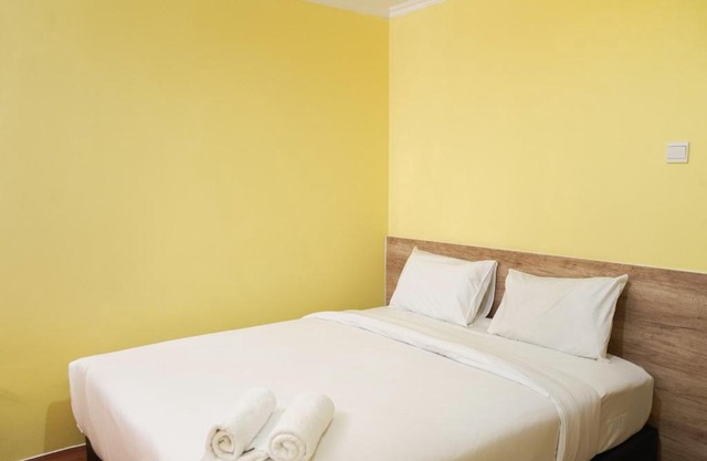 Cozy and Modern 1BR Green Central City Apartment By Travelio