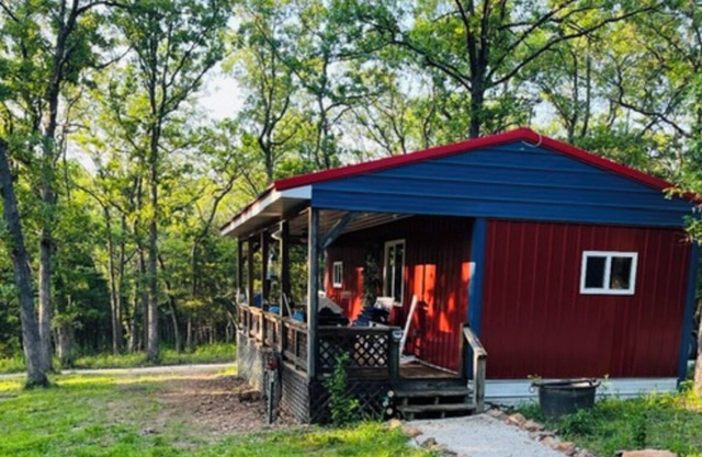 Cozy Cabin nestled on 10 acres just minutes from the lake and the speedway