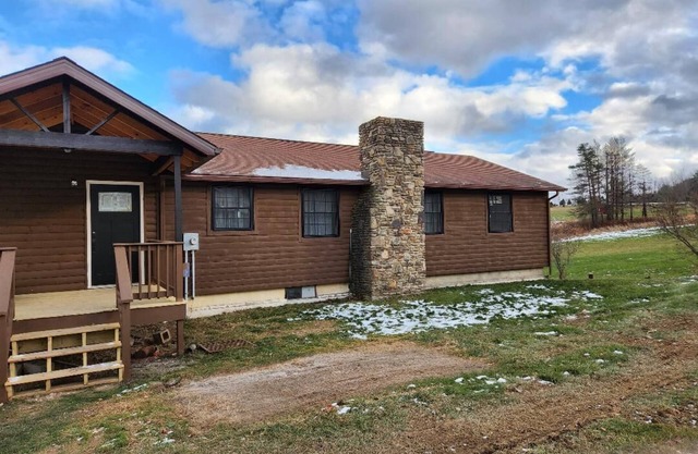 Cozy home located on 10 acres with a pond for fishing and kayaking.
