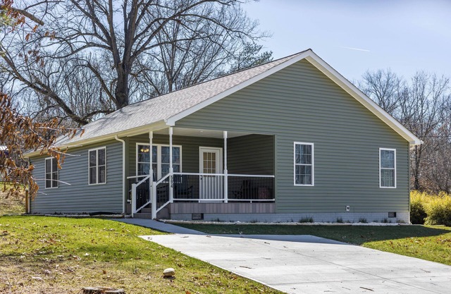 Cozy home with a modern kitchen, spacious living, serene bedrooms, and a private deck for relaxation
