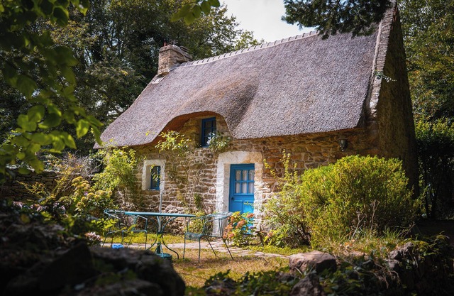 Cozy typical Breton chaumiere with thatched roof