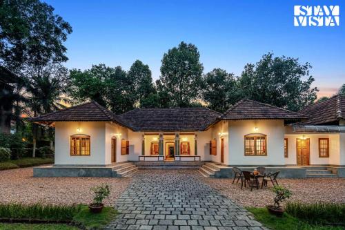 CVM House with Lawn at Thiruvalla by StayVista