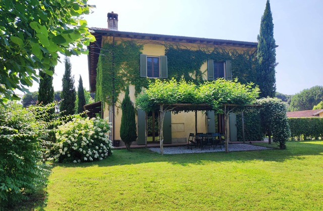 Cypress farmhouse in the park, sea and city of art