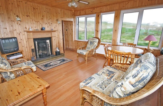 Detached croft cottage in an elevated position above Aird Bay in the spectacular north of Skye.