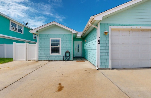 Dog-friendly duplex near beach with pool, central AC, & W/D