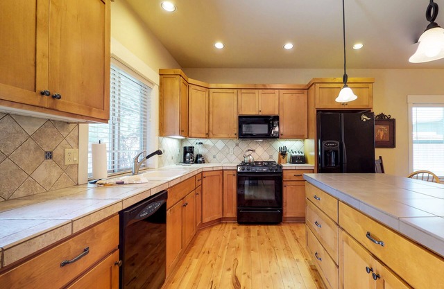 Dog-friendly home with private hot tub, sauna, furnished patio & fenced yard