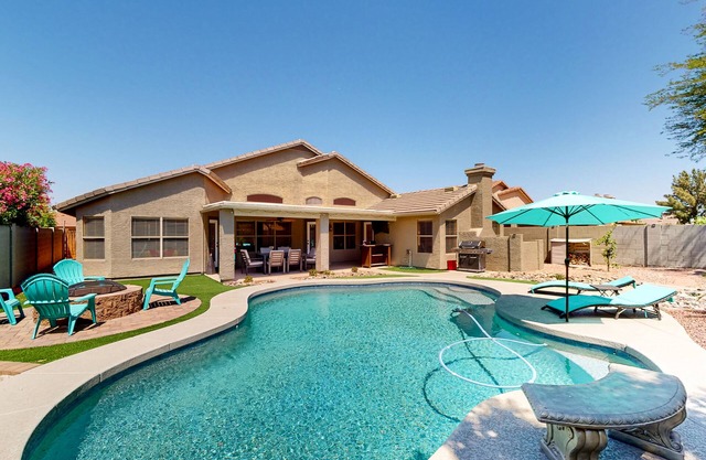 Dog-friendly home with pool, grill, office, enclosed backyard, & fireplace