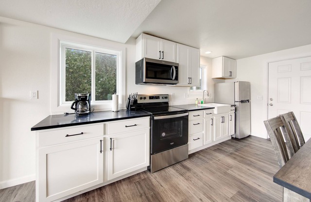 Dog-friendly oceanfront retreat with hot tub & relaxing deck facing the water
