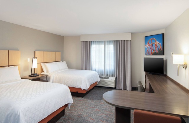 Double Suite Delight: 2 Beds, BBQ Patio, Fitness, & Pool! Pets Welcome!