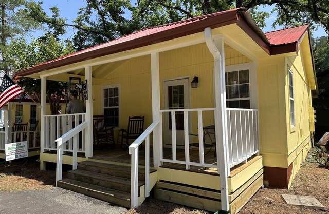 Downtown by Chattahoochee River, sit on front porch as horse and buggy stroll by