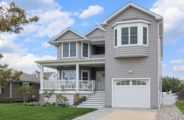 Easy to walk/bike to beach, restaurants & town. 4BR, 2.5 baths, Heated Pool.