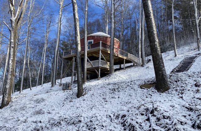 Elevated eclectic yurt with wrap-around porch, hot tub, and mountain view!