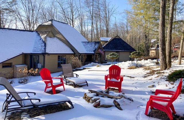 Enchanting waterfront home with hot tub, game room, fireplace, & washer/dryer