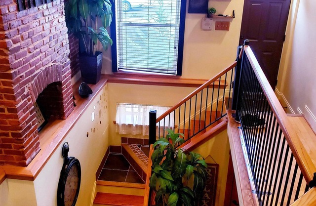 Exclusive Sunken Living Room Soaring Exposed Brick