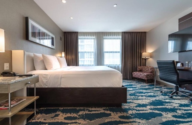 Experience Comfort in Eco-friendly Room w/Earth Tone Furniture