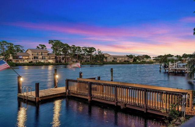 Experience island living at its finest in this private Jupiter River Estate