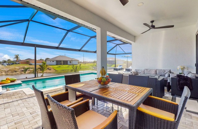 Exquisite riverfront home with pool, lanai, fireplace, W/D, 7 dog-friendly