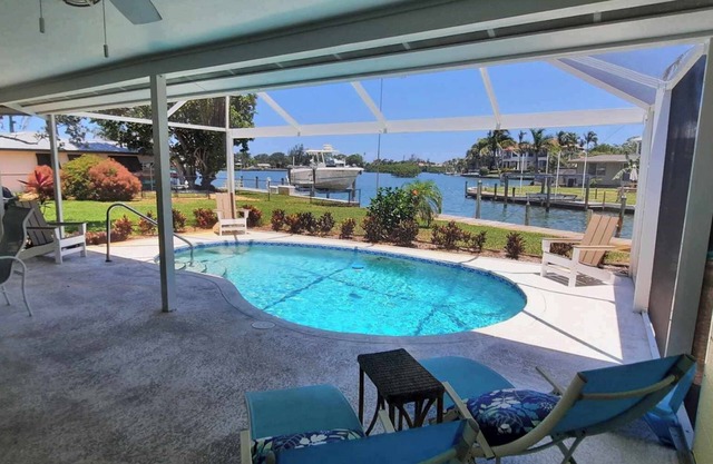 Family beach home! Renovated waterfront home with pool, dock, and nearby beach