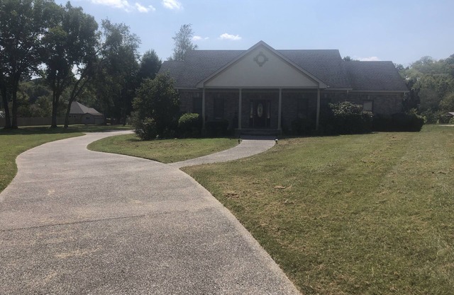 Family style one level home with a modern flair on a one acre lot.