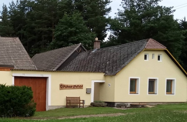 Farmhouse in the forest district near the forest