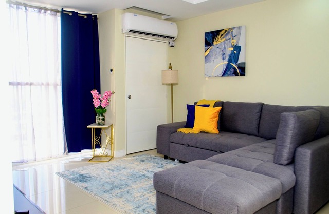 Gated 1-bedroom Condo in Portmore with AC, WiFi, Pool, Kitchen, TV, Beach View