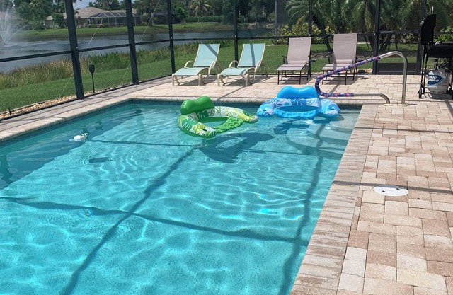 Gorgeous lake view sunsets with heated, enclosed pool. Close to beaches and golf